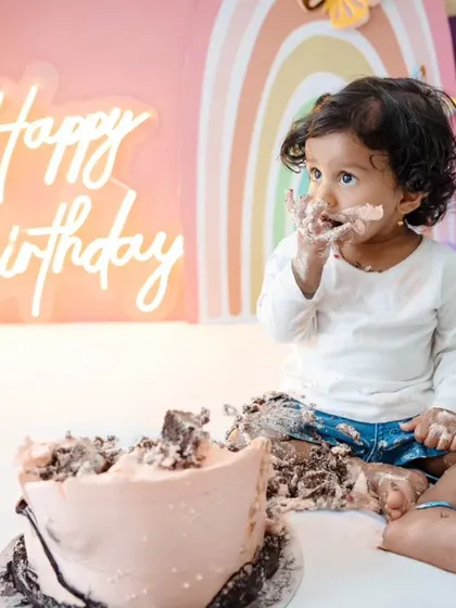 This little one is savoring every bit of her birthday cake. These close-up shots are full of personality and charm.
