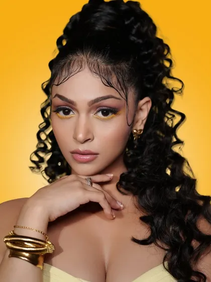 A confident and glamorous pose from our Summer Edit. The high ponytail and expertly applied makeup create a powerful and striking image that is both modern and timeless.