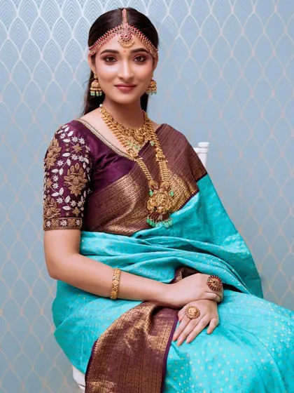 A classic portrait showcasing our layered temple necklaces and matching matha patti. This is a popular rental choice for brides in Bangalore.