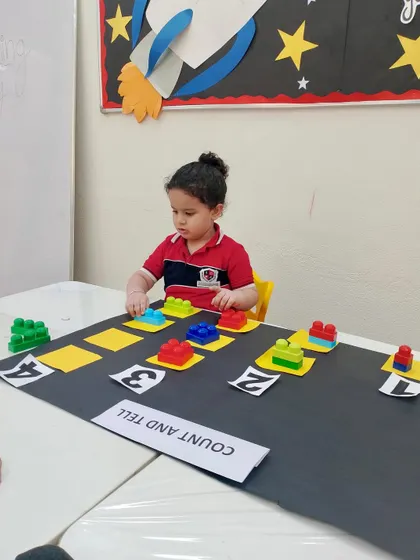 With intense focus, this child works on her counting and matching skills. Our play-based math activities are designed to hold a child's attention while they learn important foundational concepts.