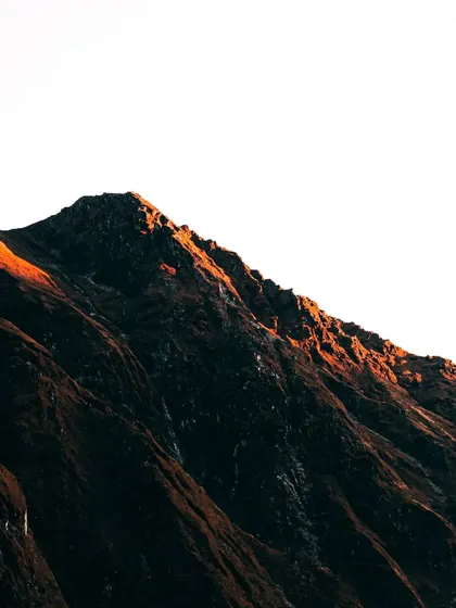 The first light of dawn hitting the peak of a mountain near Kedarnath. Chasing sunrises at high altitudes is challenging but rewards with moments of pure, unfiltered beauty like this.