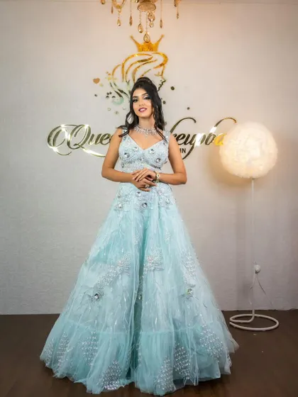 A full shot of the model in the sky-blue lehenga, showcasing its sparkle.