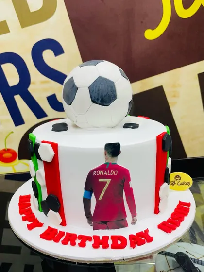 A 2kg football cake for a Ronaldo fan, with an edible print of the player and a 3D soccer ball on top.