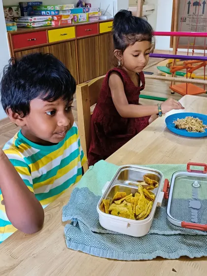 A duplicate of the previous image, showing children at snack time.
