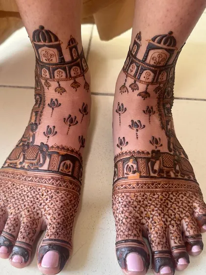 A royal-themed design for the feet, featuring palace architecture and elephants, with delicate lotus motifs scattered around.