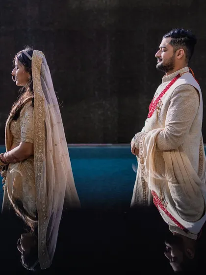 An artistic reflection shot by the poolside. We love using creative techniques to produce unique and stunning wedding portraits.