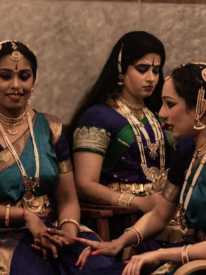 Dancers waiting in the wings, a picture of grace and anticipation before their performance.