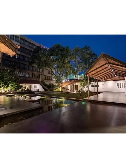 Another night view of the completed KLE Centenary Museum, showcasing the interplay of light, water, and architecture. The project has become an important public space for the city.