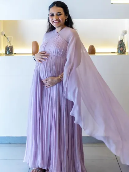 The pregnancy glow is real! A full length shot of Ushma in her beautiful lavender gown.