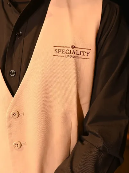 A close-up of our team's uniform. The "Speciality Experiences" logo represents our commitment to quality and professionalism.