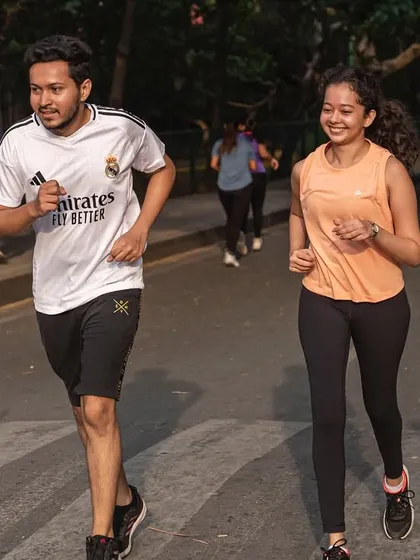 Smiles during the miles. Two members enjoying their run together, showcasing the social and fun aspect of our club.