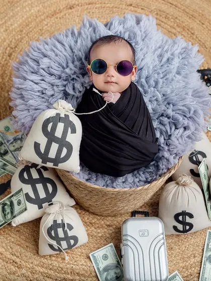 And now he's awake and ready for business! The cool sunglasses and confident look make this 'Boss Baby' portrait absolutely unforgettable.