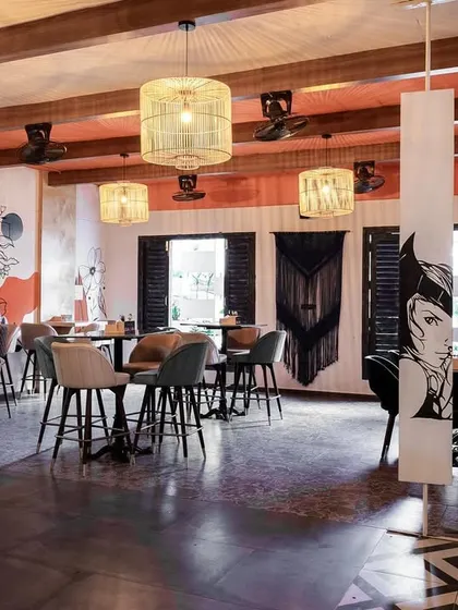 The finished comic-themed space, where every surface contributes to the illusion of being inside a graphic novel. The rotating panels feature different characters, adding an interactive element to the design.