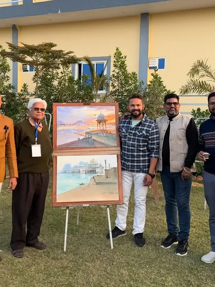 Posing with senior artists and my landscape paintings at the conclusion of the camp.