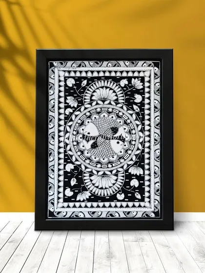 A second mockup of the framed 'Madhubani Machali' against a yellow wall. The simple black frame complements the artwork's monochrome palette perfectly.