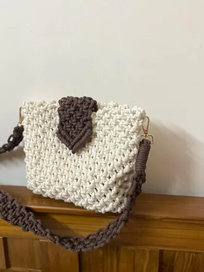 A simple, clean shot of my two-tone sling bag. It's perfect for anyone who loves a neutral palette but still wants something with character.