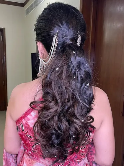 Another view of the pearl-accented ponytail, showing its beautiful movement.