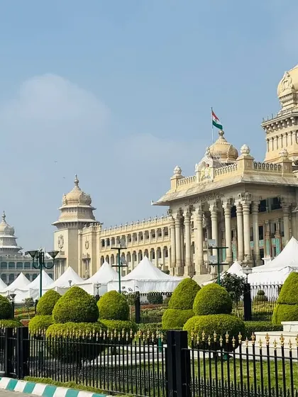 A wide shot of the EV Expo setup against the backdrop of the Vidhan Soudha. I installed rows of German Hangar tents, creating a large-scale, professional exhibition space in a prestigious location.
