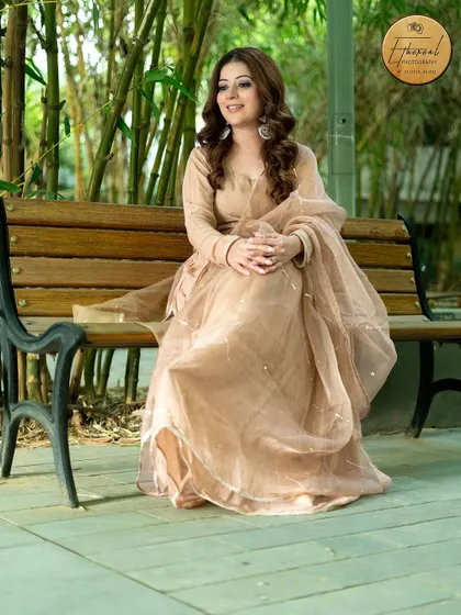 A calm and graceful outdoor portrait of an influencer. The natural background with bamboo adds a peaceful and organic feel to the image.