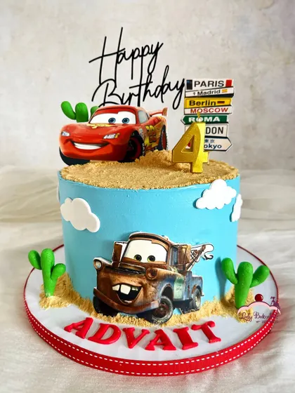 Kachow! A Lightning McQueen cake ready to race. This design features McQueen and Mater in the desert, complete with edible sand and cacti.