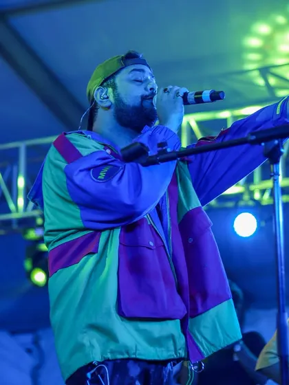 A dynamic shot of singer Shashwat Singh engaging the crowd, showcasing his energetic stage presence.