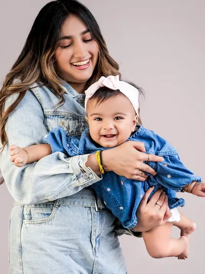 Pure, unrestrained joy between a mother and her baby. My goal is to capture these authentic moments of laughter and love.