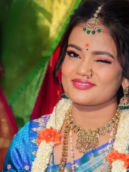 A playful wink from the bride. This fun and confident portrait perfectly captures her personality and the happy spirit of the wedding day.