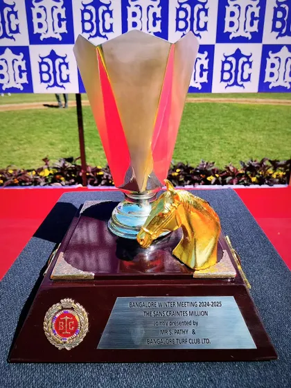 The Sans Craintes Million trophy, a modern and artistic silver cup with a golden horse head.