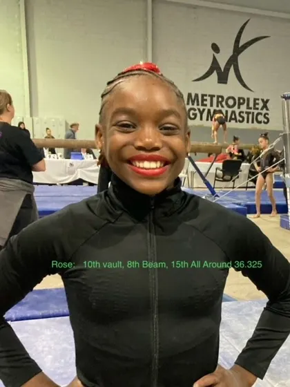 Rose, one of our Level 7 gymnasts, smiling after a successful state meet where she qualified for regionals.