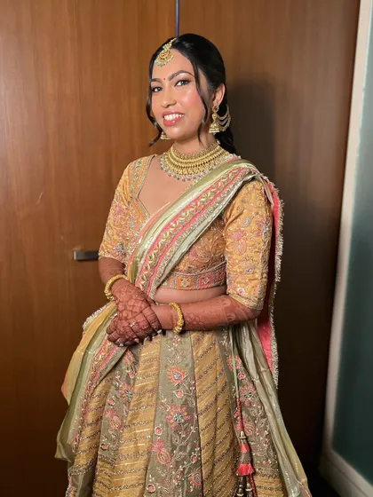 Pari looking radiant and happy. The soft glam makeup enhances her features beautifully, and the intricate braid is a perfect traditional touch.