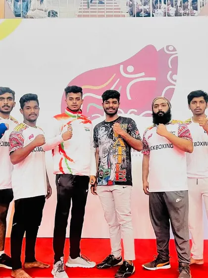 Posing with my team at the national kickboxing event. We travel across India to prove our skills.