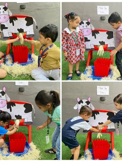 A group of friends gathers around the cow, eager for their turn. Our activities are designed to encourage curiosity and participation from every child.