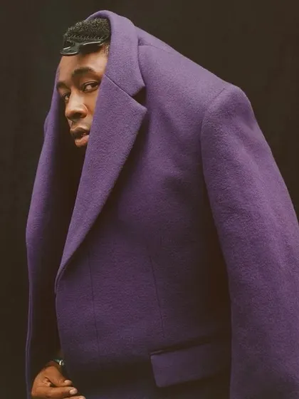 This is an example of my avant-garde and conceptual work. The unconventional styling of this purple tweed coat challenges traditional menswear norms, positioning it as a piece of wearable art and showcasing my creative direction in trend-setting fashion.