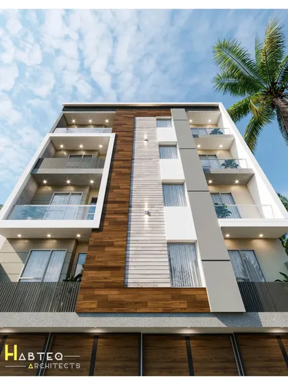 A low-angle day view of a recently proposed elevation for a 43-foot wide residential building. This perspective highlights the vertical design elements, including the interplay between wood, white, and grey sections.