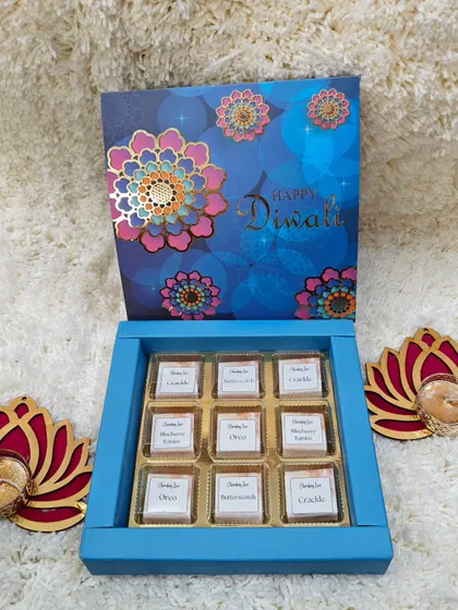 A classic corporate gift: a box of my signature handmade chocolates. This nine-piece set comes in a festive blue box and is paired with two beautiful lotus-shaped T-light holders.