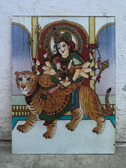 Here, the divine warrior Goddess Maa Durga is depicted riding her tiger, a symbol of immense strength and protection. I use vibrant gemstones to detail her form and weapons, creating an artwork that fills your home with courage and positive energy.