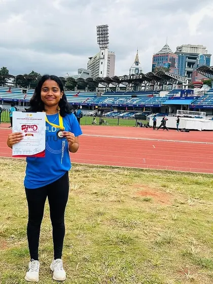 Driti Das with her bronze medal for the 400m race at the Dasara division meet.