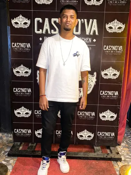 Standing in front of a branded wall at Casinova. This photo shows my presence at one of Koramangala's popular venues.