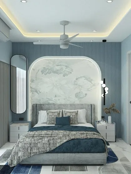 A bedroom design with a cool and calming color palette. The wall behind the bed features blue fluted paneling and a custom arched wallpaper inset, creating a soft and dreamy focal point.