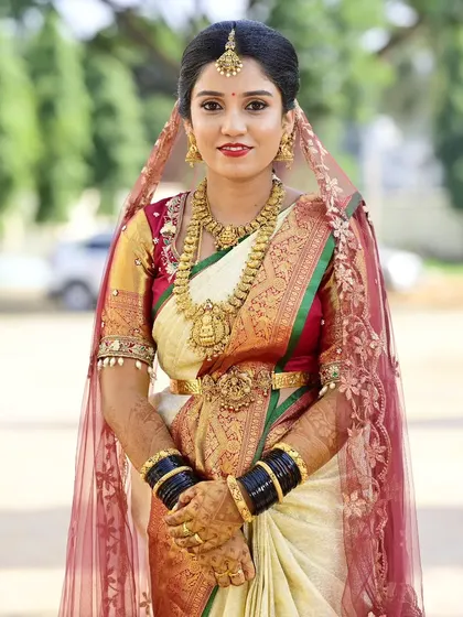 Sahana's complete muhurtham look with the veil. The makeup is designed to be visible and radiant, even with the addition of a traditional head covering.