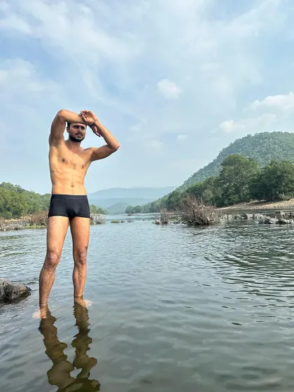 A dynamic pose in the water, looking out towards the horizon.