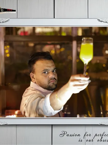 A bartender raises a glass, toasting to a successful Sufi Night event where our mocktails were a huge hit.