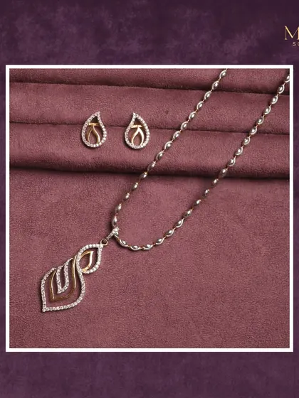 Delicate charm and minimalist shine. This matching necklace and earring set features a simple, leaf-inspired design paved with diamonds. It's perfect for those who love subtle sophistication.