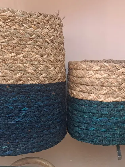 These beautiful storage baskets feature a natural top and a deep blue dyed bottom. They come in sets of different sizes, perfect for organizing any room in the house.