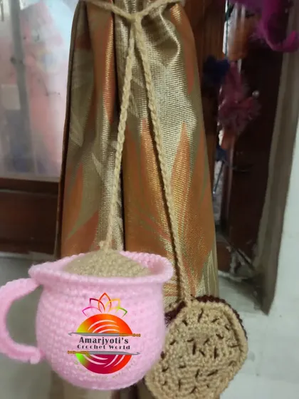 For all the coffee and tea lovers, I designed this curtain tie-back shaped like a pink teacup with a biscuit. It's a quirky and fun addition to a kitchen or dining area.