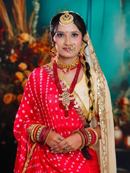 A full portrait of a student's Rajasthani-inspired bridal creation. The bandhani dupatta and traditional jewellery are key elements of this vibrant and culturally rich look.