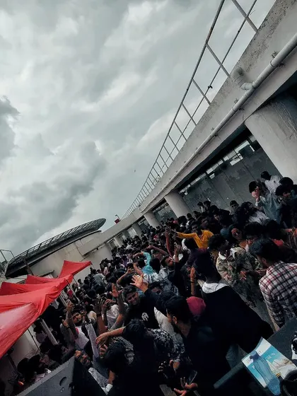 A photo from a packed rooftop Onam celebration party. I am experienced in performing for special events and cultural festivals.