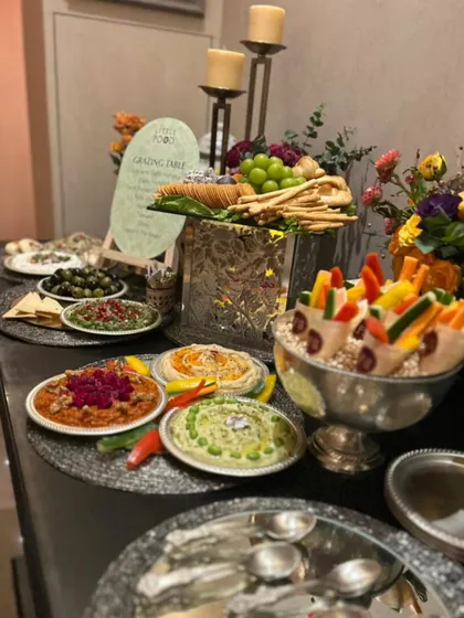 A classic grazing farm setup with a variety of dips, olives, crackers, and fresh vegetable crudités. This kind of spread is perfect for cocktail hours and social gatherings, offering something for everyone to enjoy.