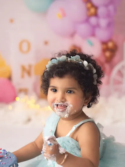 That sweet, frosting-covered face just melts my heart. This little one had the best time exploring her first birthday cake.
