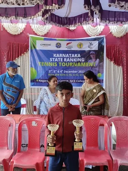 We celebrate the total domination by our players at the State Ranking Tennis Tournament in Mysore. Here is Ishaan, proudly holding his trophies after winning both the U-12 and U-14 singles titles.